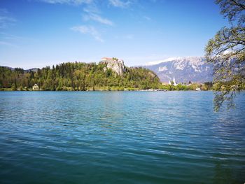 Scenic view of lake against blue sky