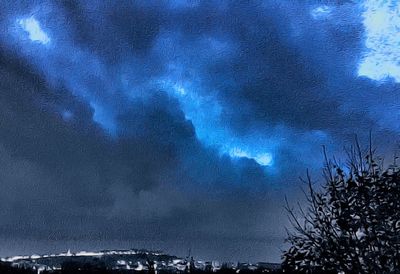 Low angle view of cloudy sky at night