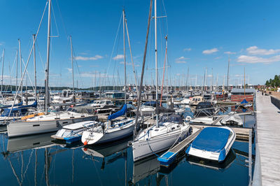 Boats moored at harbor