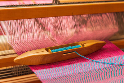 High angle view of thread on weaving machinery