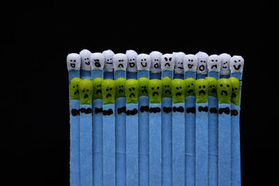 Close-up of multi colored candies against black background