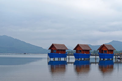 Boat sheds on the shore of lang co lake