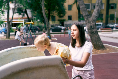 Siblings playing on playground