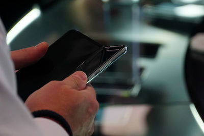 Close-up of man using mobile phone