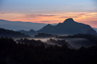 Scenic view of mountains against sky during sunset