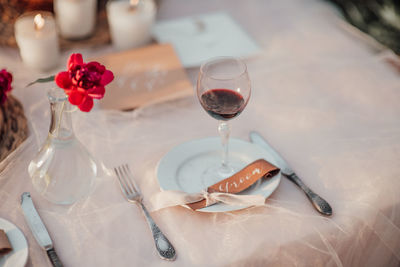 Close-up of wine glasses on table