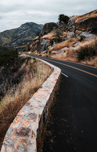 High angle view of road by mountain against sky