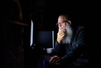 Man sitting on table at home