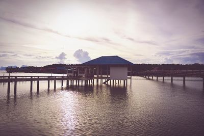 Scenic view of river against sky at sunset