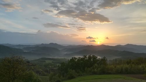Scenic view of landscape against sky during sunset
