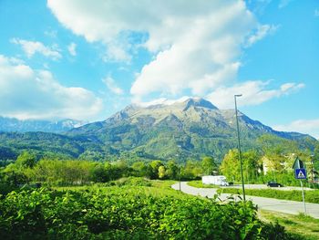 Scenic view of mountains against cloudy sky