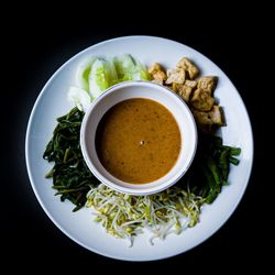 High angle view of food on table against black background
