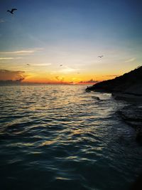 Scenic view of sea against sky during sunset