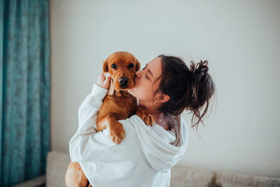 Woman with dog at home