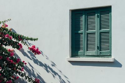 Close-up of closed window on the wall