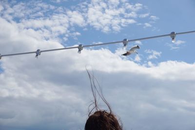 Low angle view of cables against sky