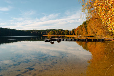 Lake baltieji lakajai in labanoras regional park and wooden pier with benches for relaxation