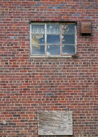 Low angle view of brick wall