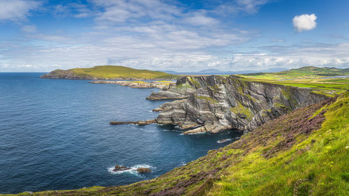 Large panorama with kerry cliffs and blue coloured atlantic ocean on a sunny summer day, ireland