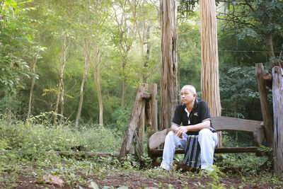 Woman sitting in a forest