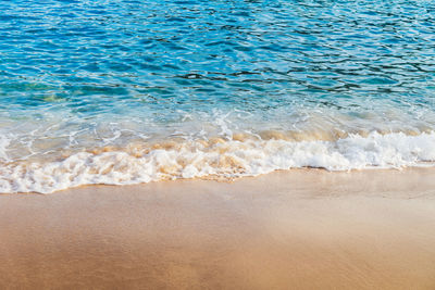 High angle view of surf on beach