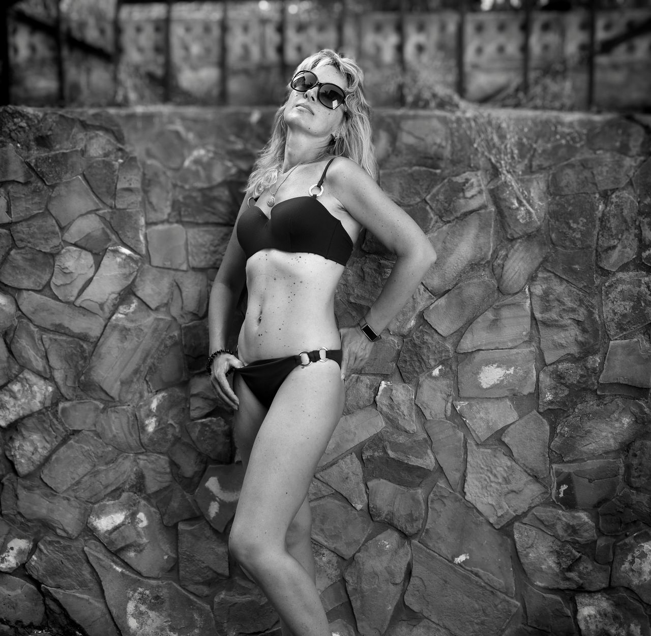 black and white, women, one person, adult, clothing, monochrome photography, young adult, fashion, photo shoot, monochrome, swimwear, lifestyles, bikini, lingerie, black, full length, hairstyle, brassiere, female, white, long hair, leisure activity, portrait, glasses, underwear, sunglasses, nature, person, human leg, swimsuit bottom, outdoors, blond hair, day, undergarment, summer, standing, relaxation, looking, sitting, hand