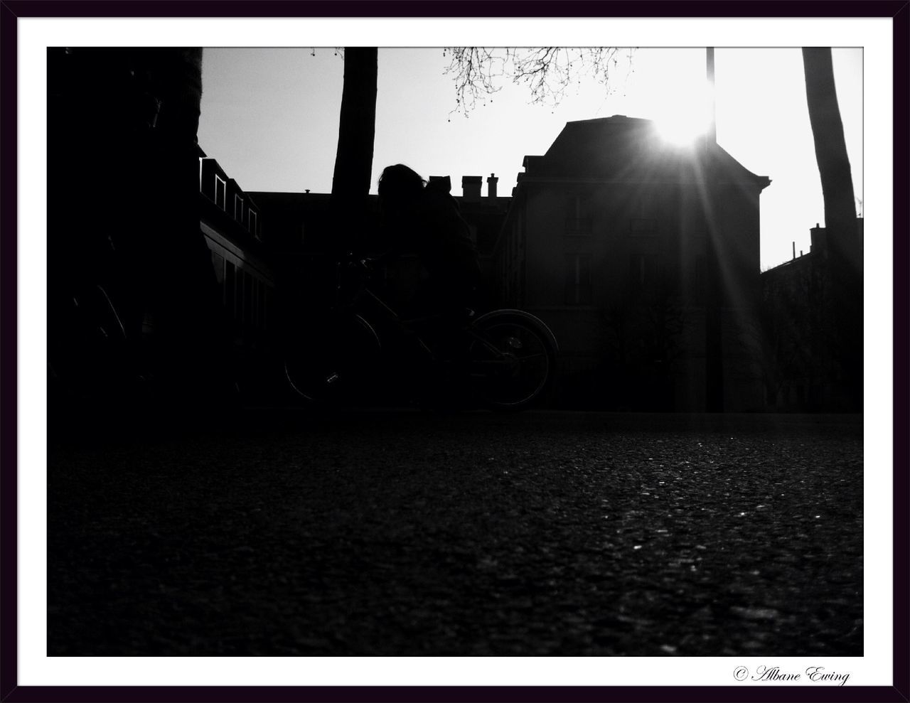 transfer print, building exterior, architecture, built structure, transportation, auto post production filter, land vehicle, mode of transport, street, car, sunlight, clear sky, city, bicycle, road, stationary, parked, building, sky, house