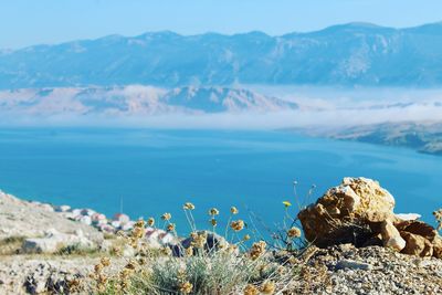 Scenic view of sea against mountains