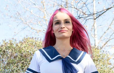 Portrait of beautiful young woman in park