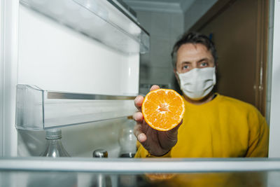 Portrait of man holding ice cream