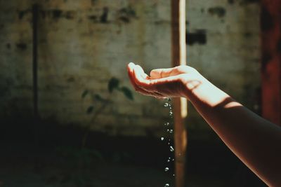 Close-up of hand holding water