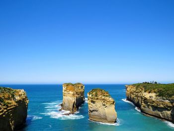 Scenic view of sea against clear blue sky