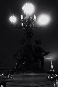 Low angle view of illuminated building against sky