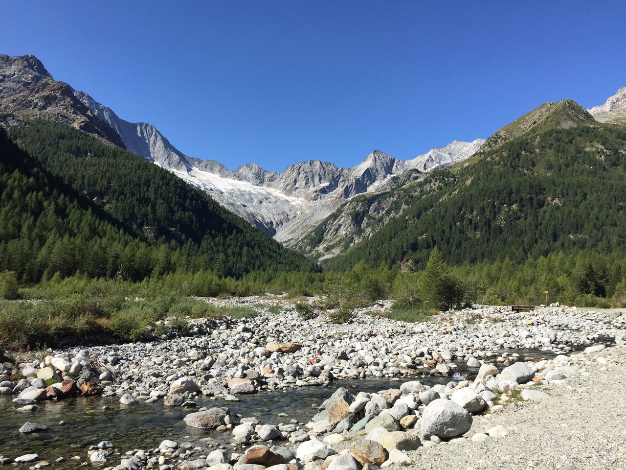 mountain, nature, beauty in nature, mountain range, day, rock - object, tranquil scene, outdoors, tranquility, landscape, scenics, clear sky, no people, forest, blue, tree, sky