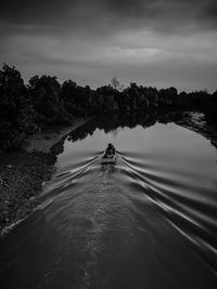 Man on boat against sky