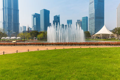 View of modern buildings in city against sky