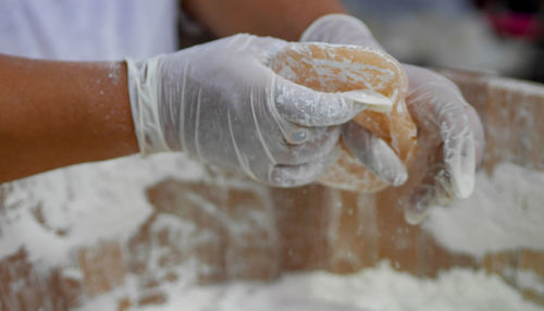 Close-up of woman hand holding white