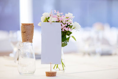 Close-up of white flower vase on table