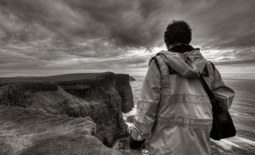 Scenic view of landscape against cloudy sky