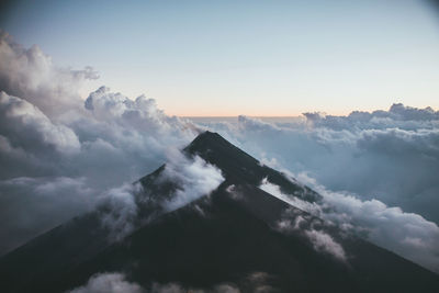 Scenic view of mountains amidst cloudscape during sunset