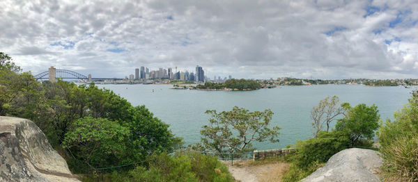 Panoramic view of river and buildings against sky