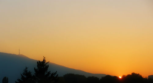 Scenic view of sunset over mountains