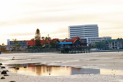 Beach against sky in city