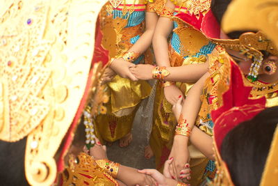 Low section of woman sitting in a dress