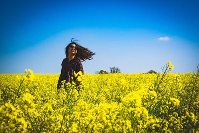 Young woman with yellow flowers