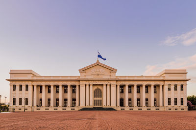 Facade of historic building against sky