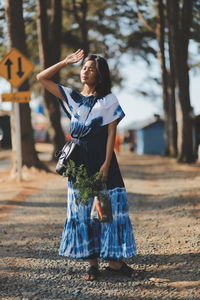 Full length of woman standing on field