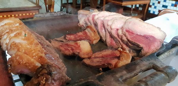 Close-up of meat on barbecue grill