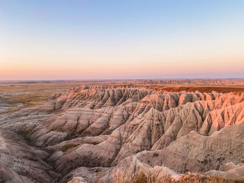 Scenic view of landscape against sky during sunrise 