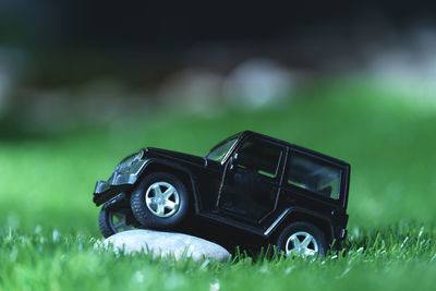 Close-up of toy car on field